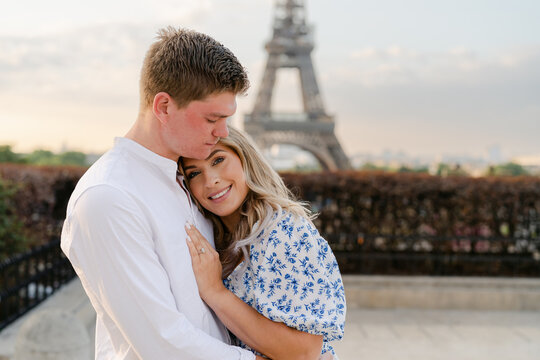 smiling couple by Eiffel tower