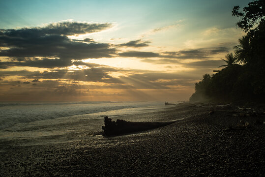 sunbeams between clouds hitting the caribbean sea