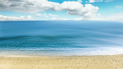 Beautiful view of seascape and blue sky with white clouds on sunny day