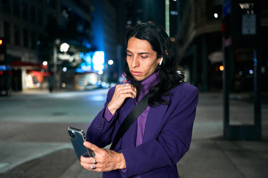 LGBT male using phone night