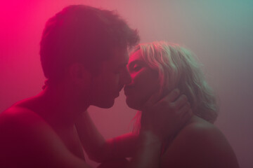 Dreamlike portrait of couple tenderly kissing