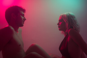 Surreal portrait of lovers staring to each other