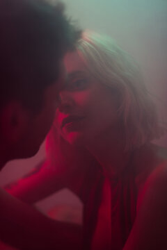 Colourful portrait of lovers staring to each other