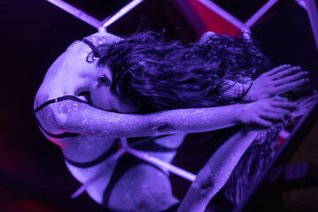 Portrait with ultra violet lighting of woman with spotted skin