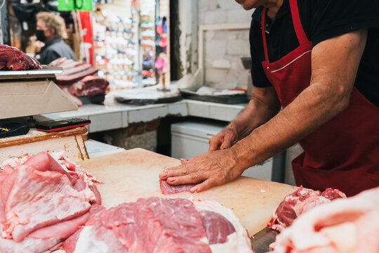 Anonymous Butcher Cutting Beef
