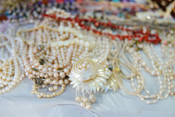 Handmade necklaces made of cultured pearls. Sale of accessories in a Mexican market.