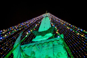 The Soldiers and Sailors monument is decorated with colorful lights at Christmas 