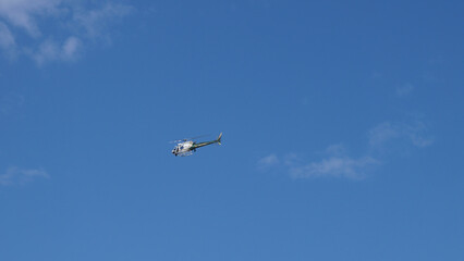 Fototapeta na wymiar Orange County Sheriff helicopter in the sky in San Clemente, California, USA