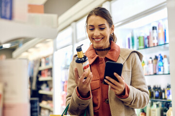 Happy woman enjoying in shopping skin care products in drugstore.