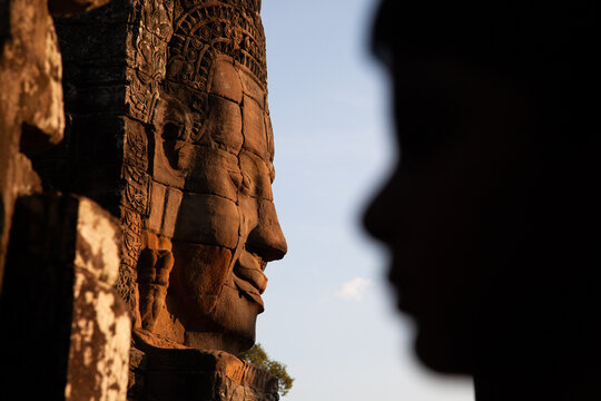 At the Bayon temple, Siem Reap. The characteristic feature of this temple comples is the gigantic smiling faces that adorn the richly decorated pillars.
