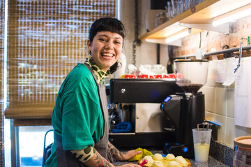 Happy worker at coffee shop kitchen