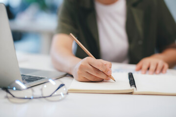 Close up of Businesswoman working at office using laptop.