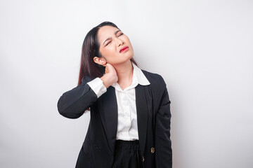Tired upset young business woman suffering from pain, muscle spasm at workplace. Fatigue, deadline,...