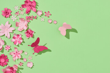 Colorful composition of handmade paper on a green background.