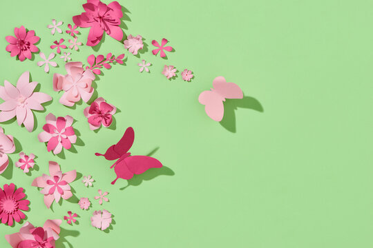 Colorful composition of handmade paper on a green background.