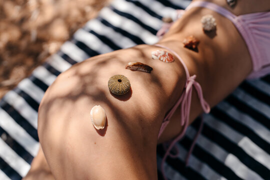 Seashells on a woman's skin and body