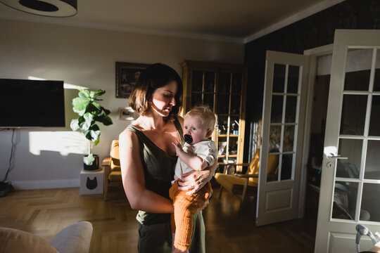 Woman and baby in sunbeam