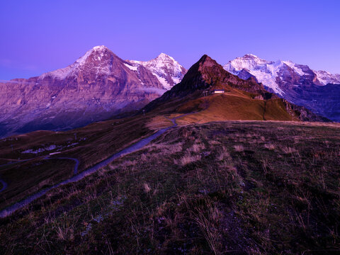 Eiger and M&ouml;nch and Jungfrau mountain peak at dusk