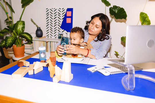 Publicist woman with baby working at office