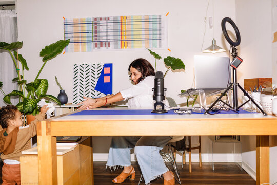Publicist PR woman and her toddler at office