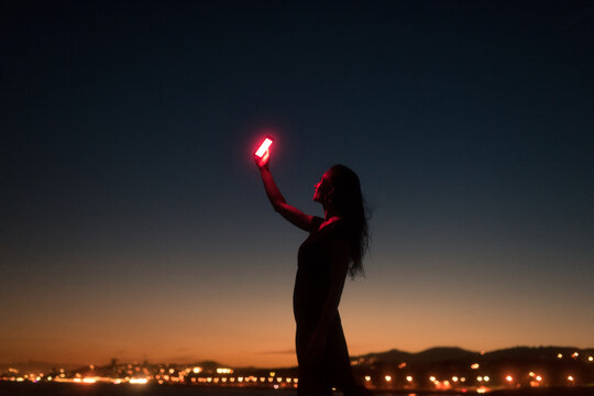 Happy woman taking surreal selfie