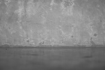 Gray concrete wall. The texture of the old plaster wall is interesting. Design background.