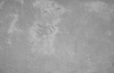 Gray concrete wall. The texture of the old plaster wall is interesting. Design background.