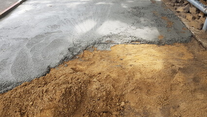 Pour the cement onto the compacted path to be a walkway.