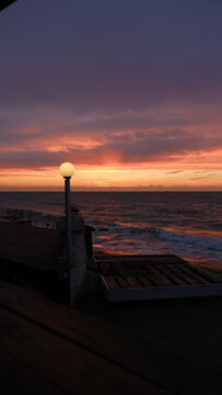 Sunrise on sea. 
Orange sky.Amazing red sunrise on beach.