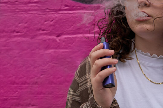 Young smoker with e-cigarette
