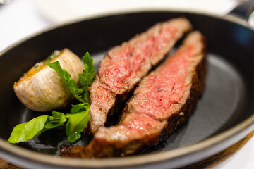 Juicy steak sliced on the plate in restaurant
