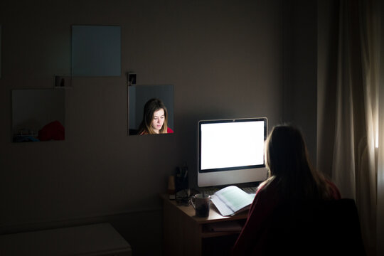 Student preparing exams at dark bedroom