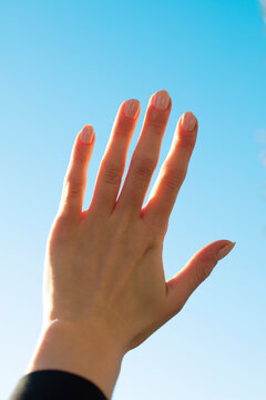 Hand reaching to the sky