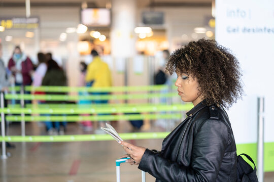 Female tourist with map in airport