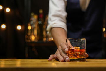 Bartender pouring Whiskey, on  bar,