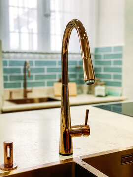 Shiny tap near sink in kitchen