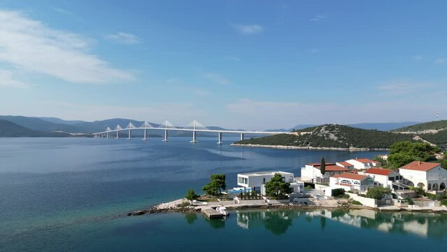 Peljesac bridge, &nbsp;suspension bridge Croatia drone aerial view bird flys into shot
