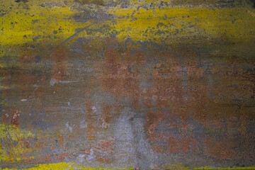 Close up rusted metal with yellow paint panel
