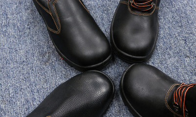 Collection of black leather shoes, usually worn by teenagers