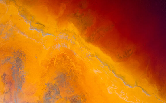 Abstract flowing rivers on vibrant orange, blue, red colors. Top view