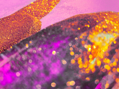 Crystal lens dusted with glowing glitter.