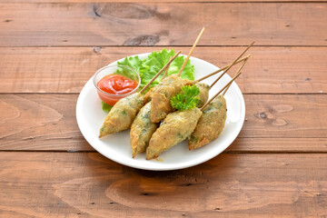 Sempol Ayam is a popular snack in the city of Malang. This practical snack is made from a mixture of chicken, tapioca flour, eggs, and various spices, then skewered on a skewer and then fried.