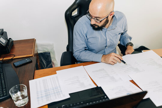 Man working with documents at his desk
