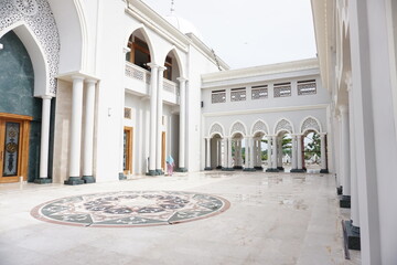 Beautiful white interior and architecture of quba mosque in madiun city.  Islam background concept. Muslim worship place. 