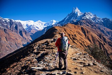 Senior man standing on the ridge in Himalayas mountains © Vedrana