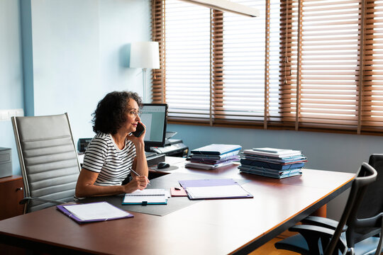 Woman on the phone with a client