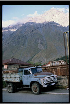 A truck in front of the mountains