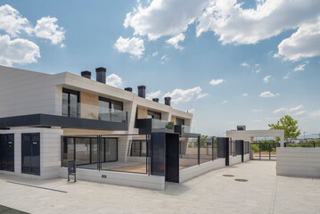 Modern luxury residential building complex entrance at daytime.