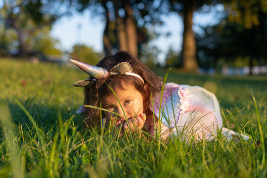 girl hiding in the grass
