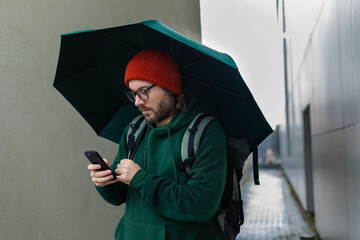 portrait of a man under an umbrella